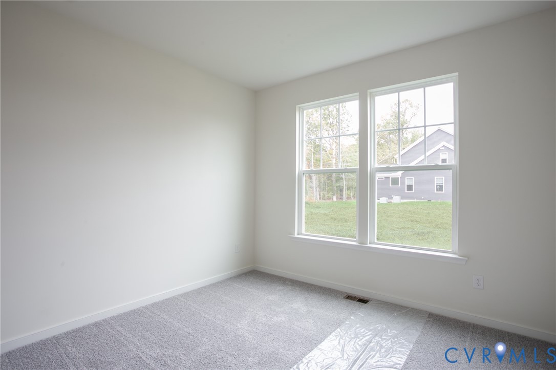 4830 Tuscany Road Moseley, VA 23120 - Photo 10 of 23 an empty room with a window