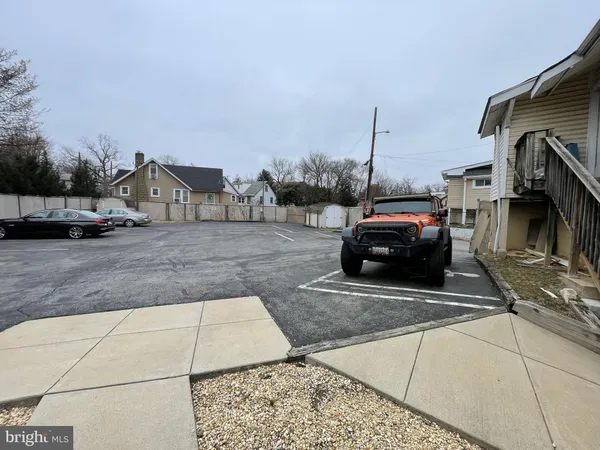 a view of a car park in front of house
