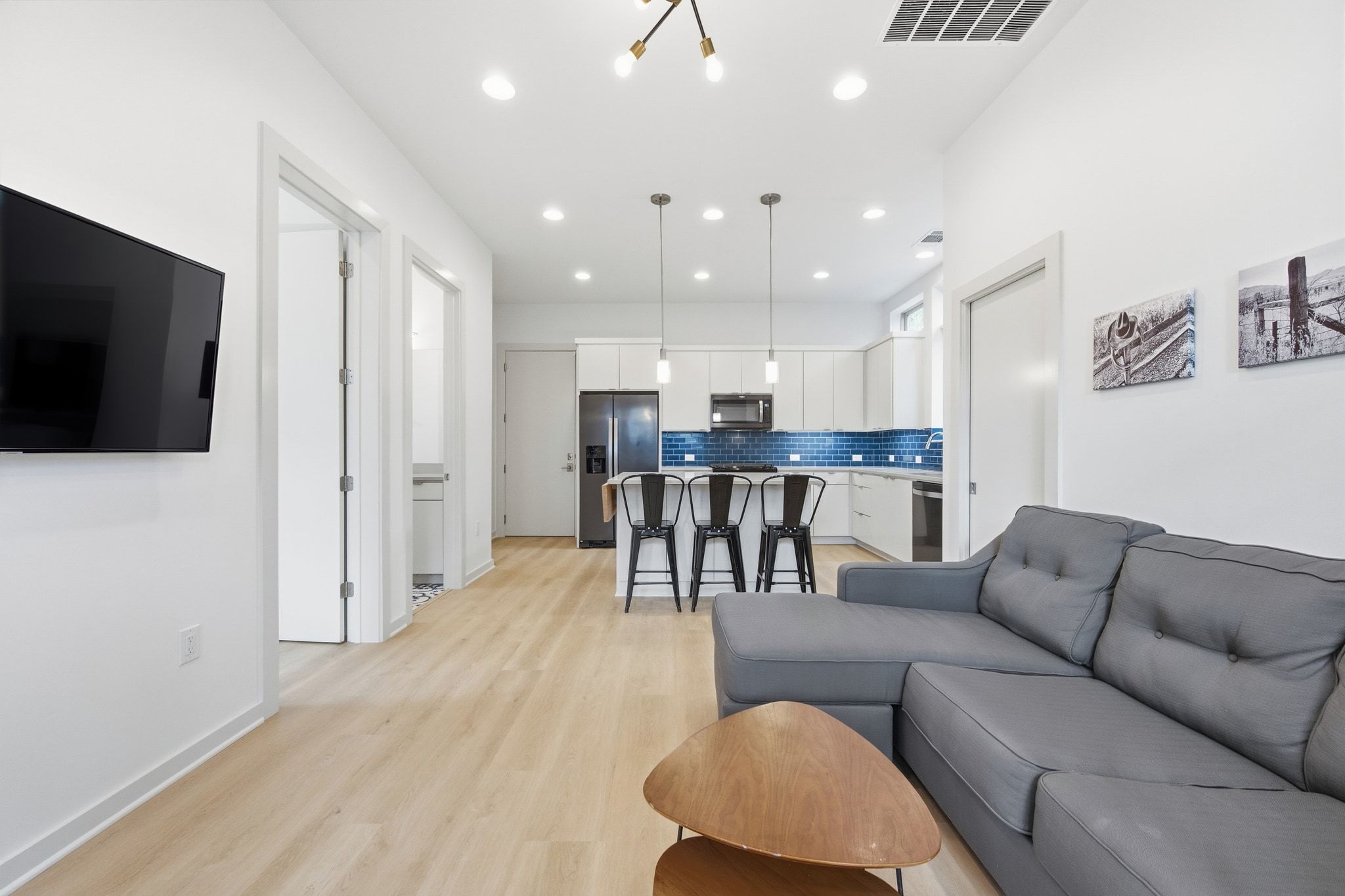 2811 Garwood Street, Unit B Austin, TX 78702 - Photo 6 of 24 Living room with light wood finished floors and recessed lighting