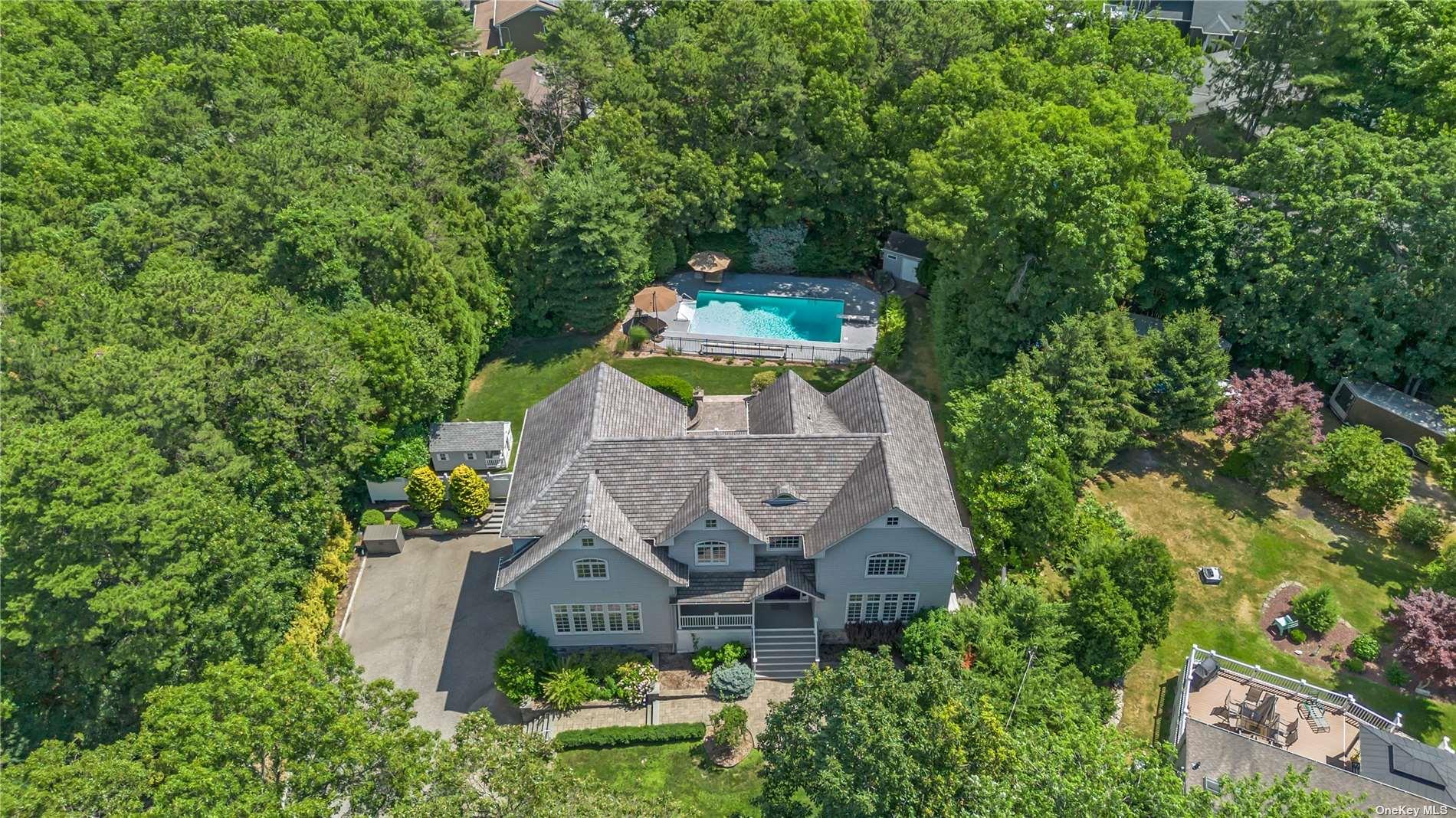 7 Pine Ridge Drive Smithtown, NY 11787 - Photo 1 of 1 an aerial view of a house with a yard plants and large tree