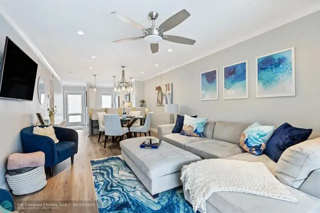 a view of a balcony with furniture and a yard