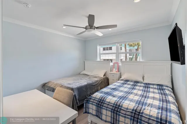 a dining room with furniture and floor to ceiling window