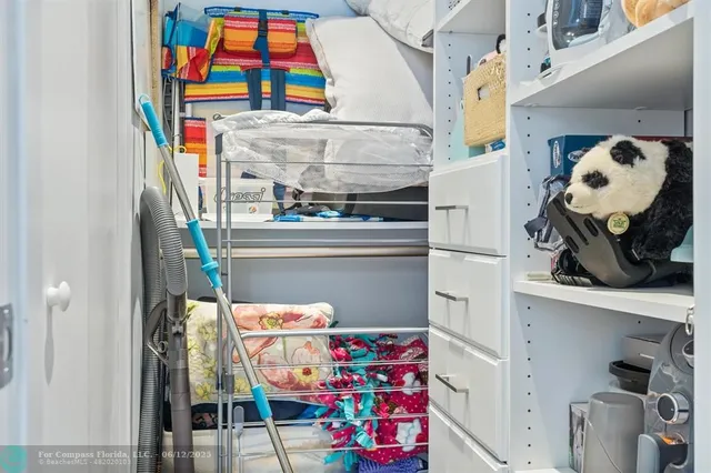 a view of a room with furniture and chandelier