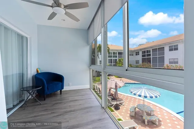 a view of swimming pool with outdoor seating