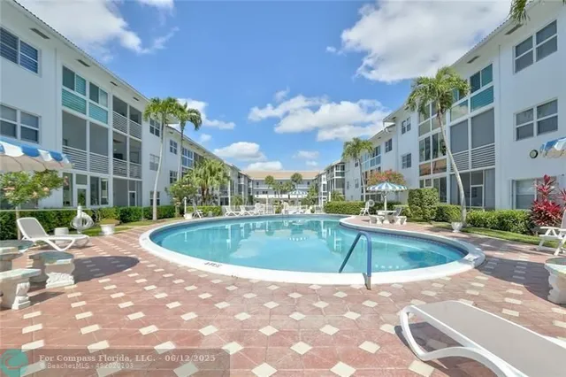 a view of a swimming pool with a patio
