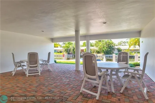 a view of outdoor space with palm trees