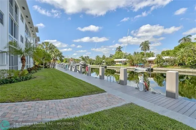 a kitchen with stainless steel appliances a refrigerator sink and microwave