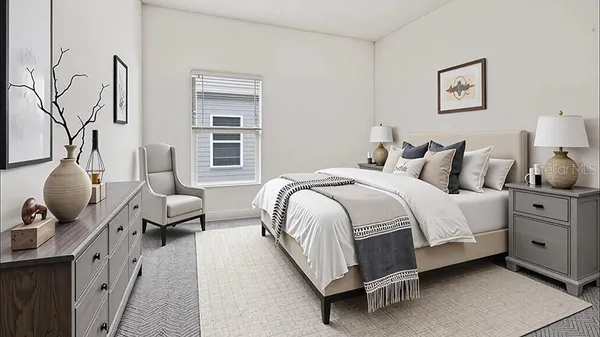 a bedroom with bed and window