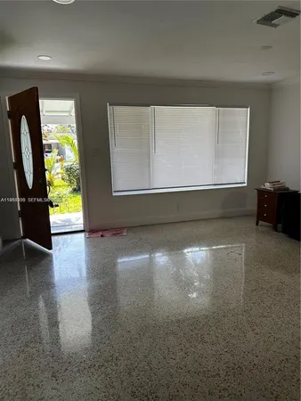 a view of room with window and hardwood floor