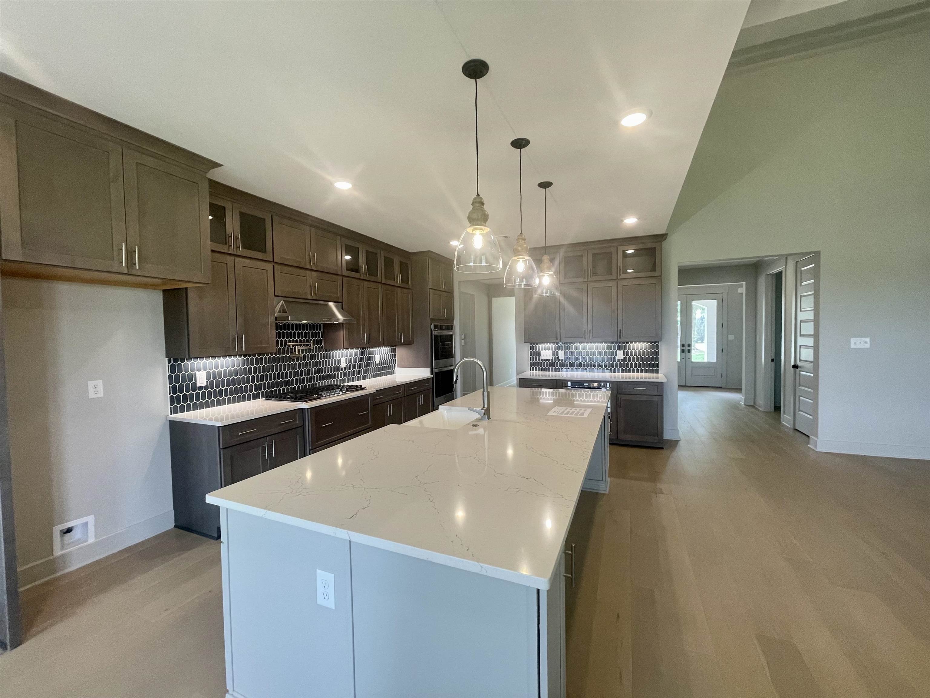 11162 Shelby Post Road Collierville, TN 38017 - Photo 14 of 23 a large kitchen with a large counter top appliances and cabinets