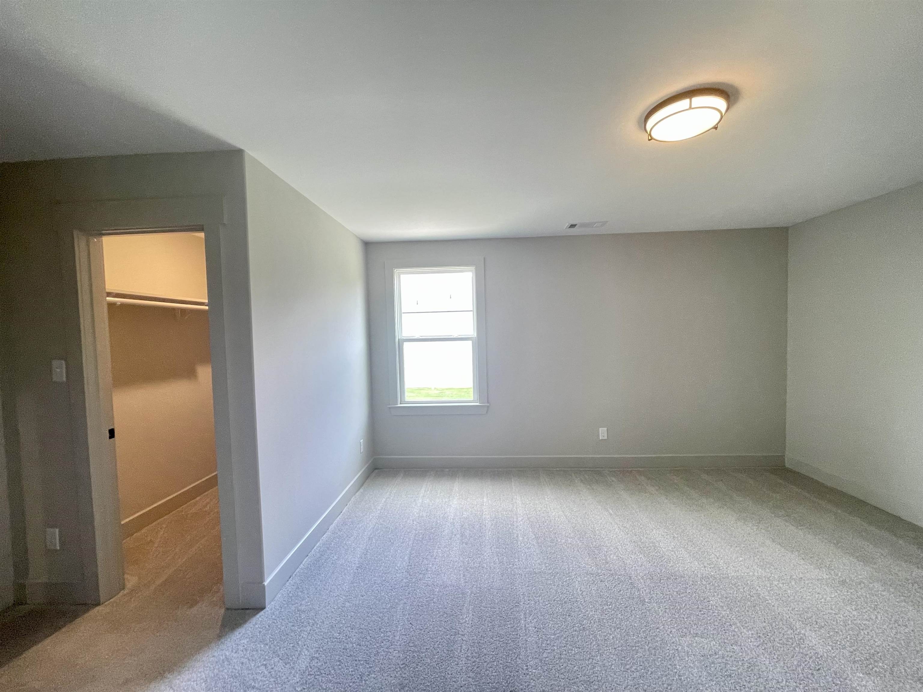 11162 Shelby Post Road Collierville, TN 38017 - Photo 18 of 23 an empty room with wooden floor and windows