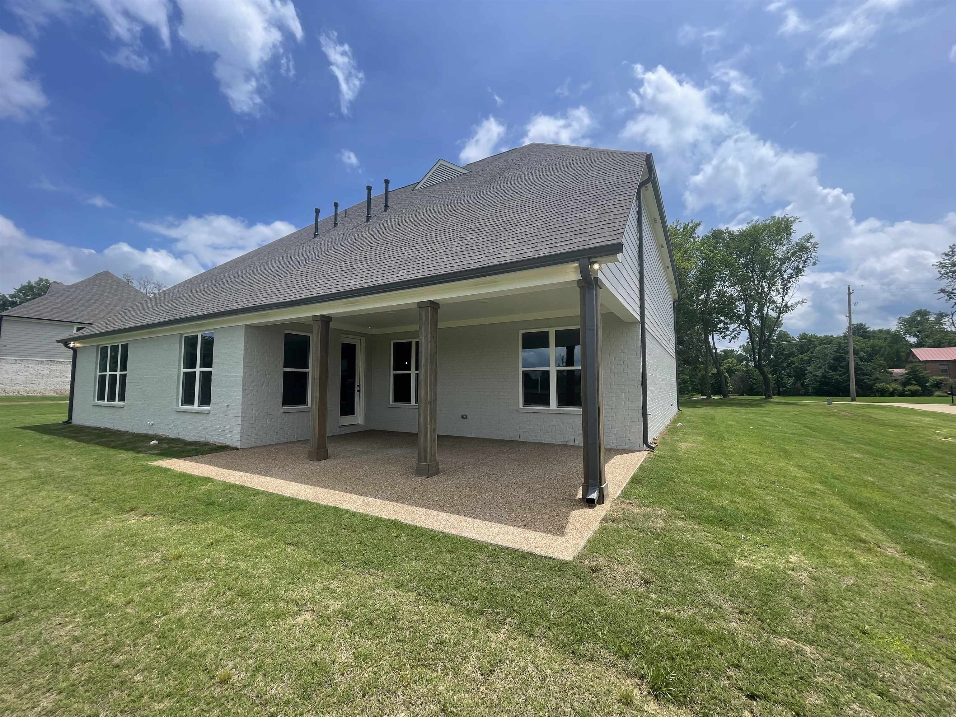11162 Shelby Post Road Collierville, TN 38017 - Photo 20 of 23 a view of a house with a yard and garden