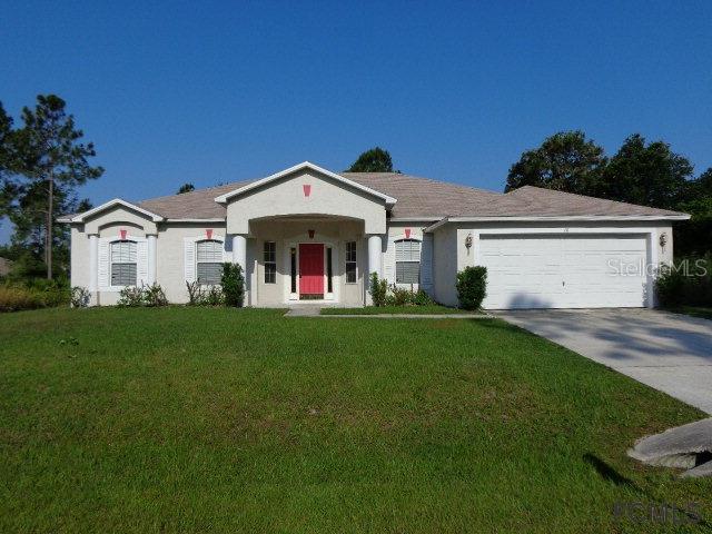 10 Roxbury Lane Palm Coast, FL 32164 - Photo 1 of 1 a front view of a house with a yard