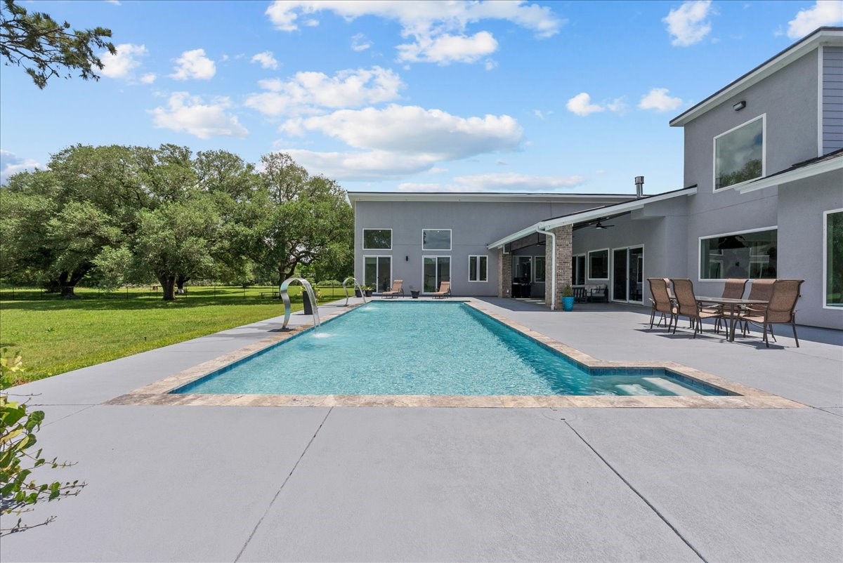 7627 Scott Avenue Manvel, TX 77578 - Photo 44 of 50 The expansive deck is perfect for sunbathing while looking out over the lush green yard.