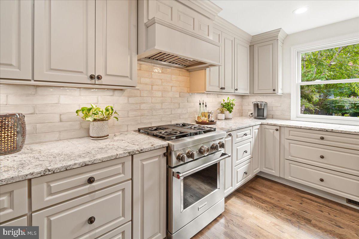 2428 Cobblestone Way Frederick, MD 21702 - Photo 16 of 83 Gas range with custom vent hood