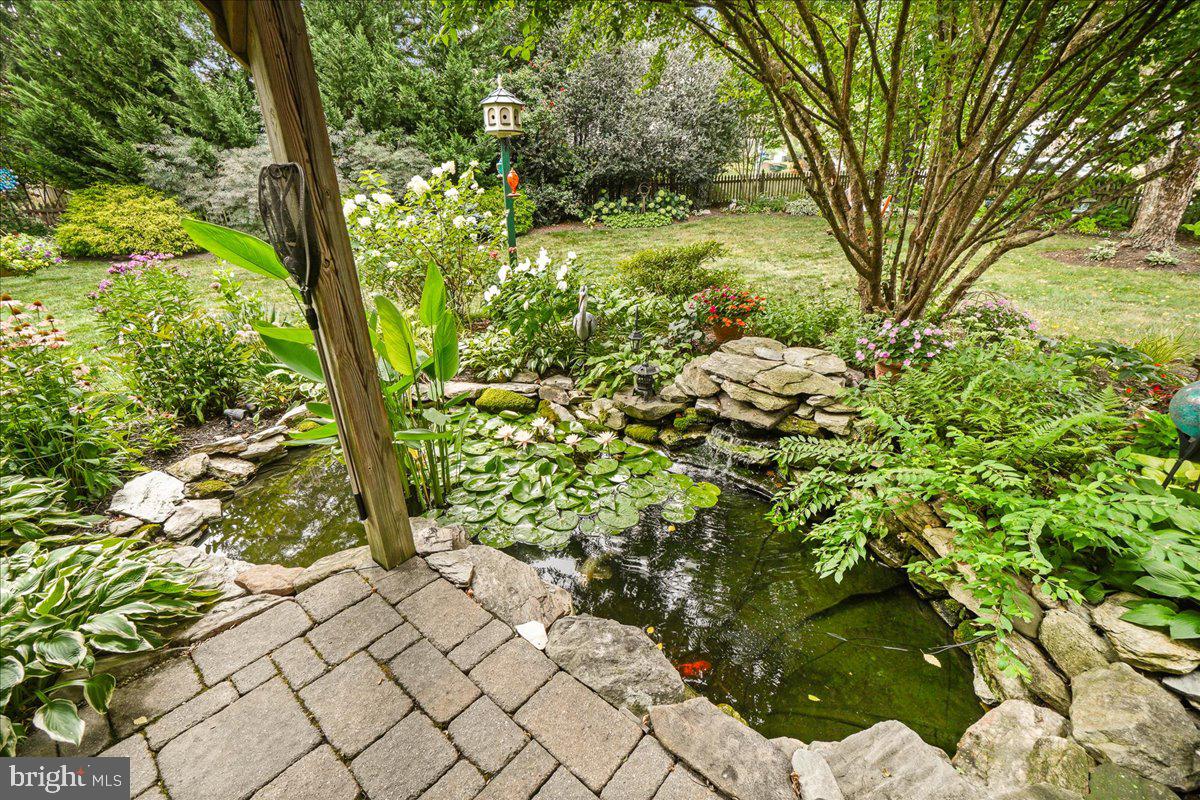 2428 Cobblestone Way Frederick, MD 21702 - Photo 45 of 83 Koi pond with water falling over stones