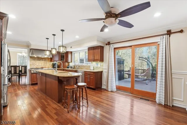 a large kitchen with lots of counter space a sink and appliances