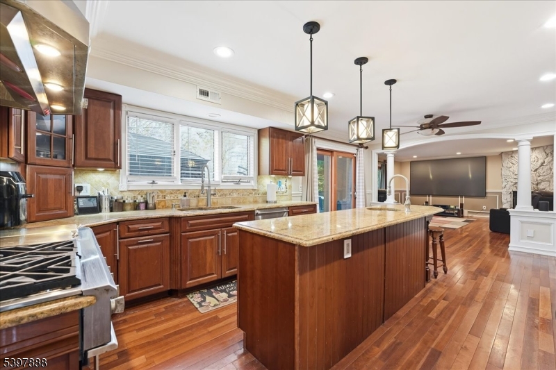 1605 Justin Place, Unit 1 Mountainside, NJ 07092 - Photo 14 of 43 a kitchen with stainless steel appliances granite countertop a sink a stove and a wooden floors