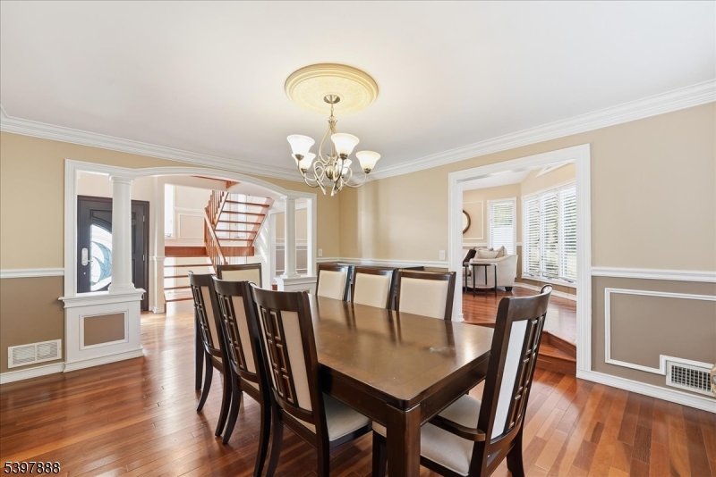 1605 Justin Place, Unit 1 Mountainside, NJ 07092 - Photo 19 of 43 a view of a dining room with furniture window and wooden floor
