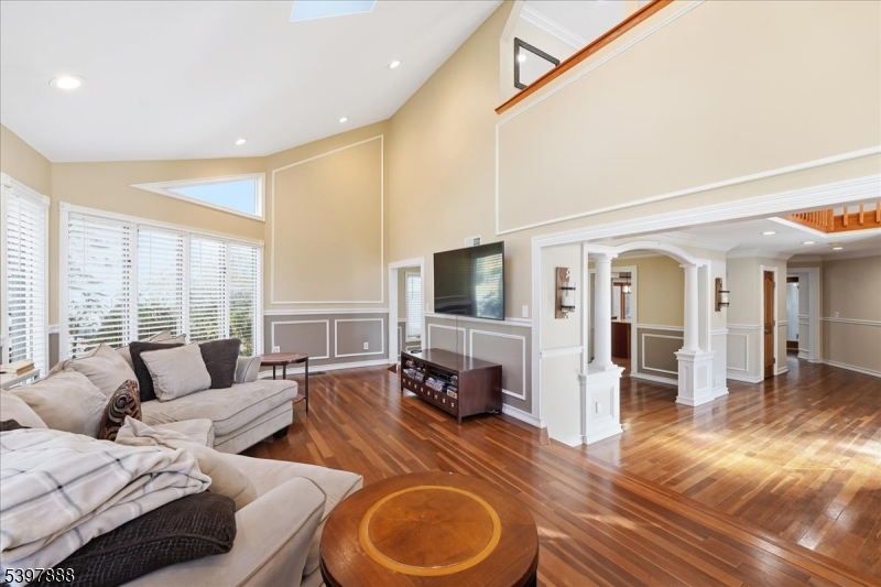 1605 Justin Place, Unit 1 Mountainside, NJ 07092 - Photo 21 of 43 a living room with furniture and a flat screen tv