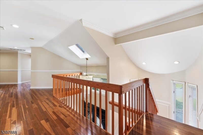 1605 Justin Place, Unit 1 Mountainside, NJ 07092 - Photo 23 of 43 a view of a hallway with wooden floor