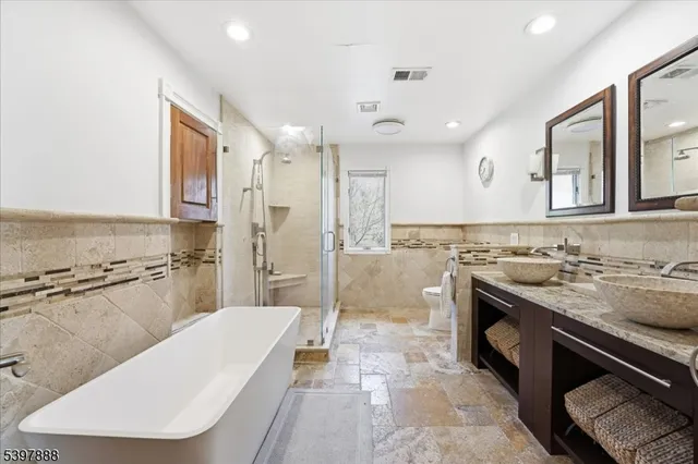 a bathroom with a sink a mirror and a bathtub