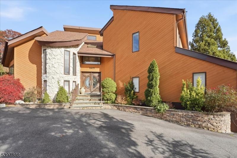 1605 Justin Place, Unit 1 Mountainside, NJ 07092 - Photo 5 of 43 a front view of a house with a yard