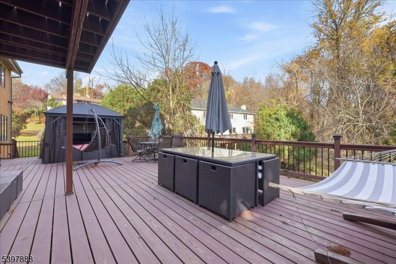 1605 Justin Place, Unit 1 Mountainside, NJ 07092 - Photo 8 of 43 a view of a balcony with wooden floor and outdoor seating