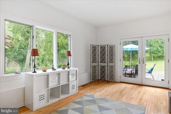 a room with window and a large window