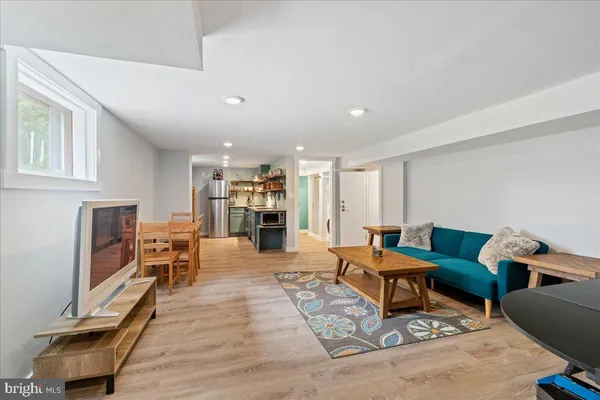 a living room with furniture and a table