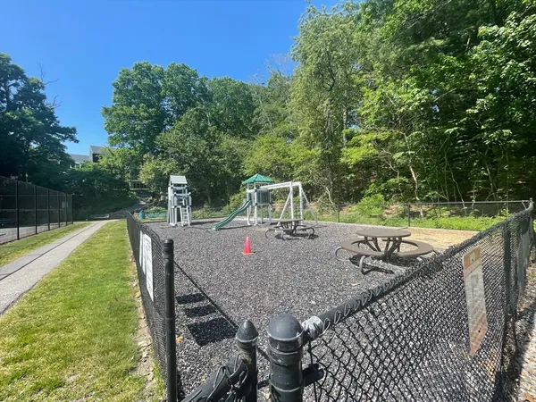 a view of a wooden deck and a yard