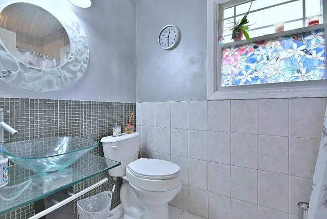 a bathroom with a toilet and a sink