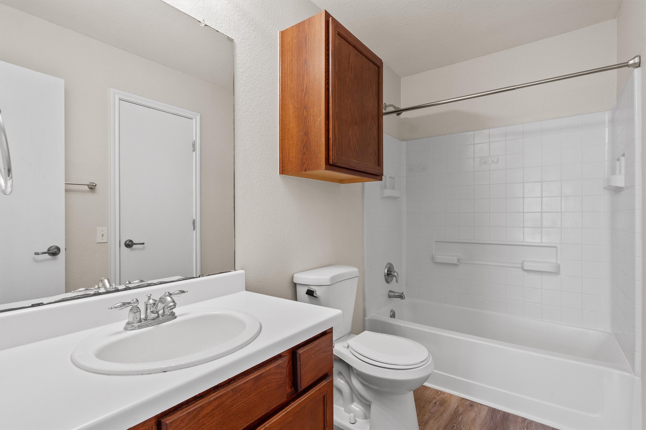5825 Silver Screen Drive Austin, TX 78747 - Photo 17 of 40 Functional bathroom featuring a vanity with a white countertop and a convenient shower-tub combination.