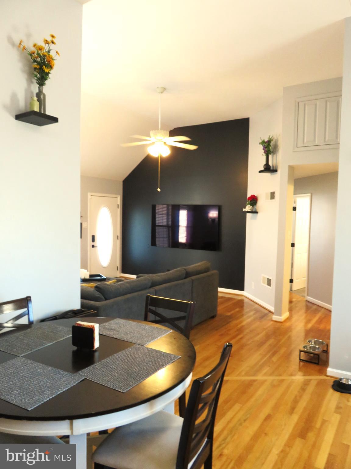 28 Bryan Drive Rehoboth Beach, DE 19971 - Photo 11 of 41 a kitchen with a table and chairs in it