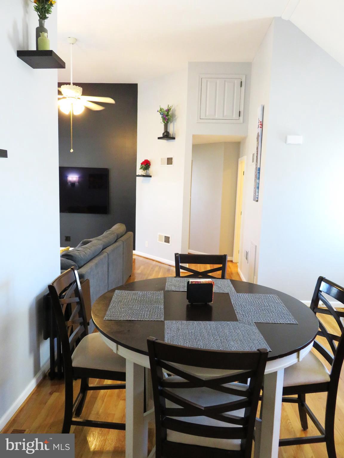 28 Bryan Drive Rehoboth Beach, DE 19971 - Photo 12 of 41 a view of a dining room with furniture and wooden floor