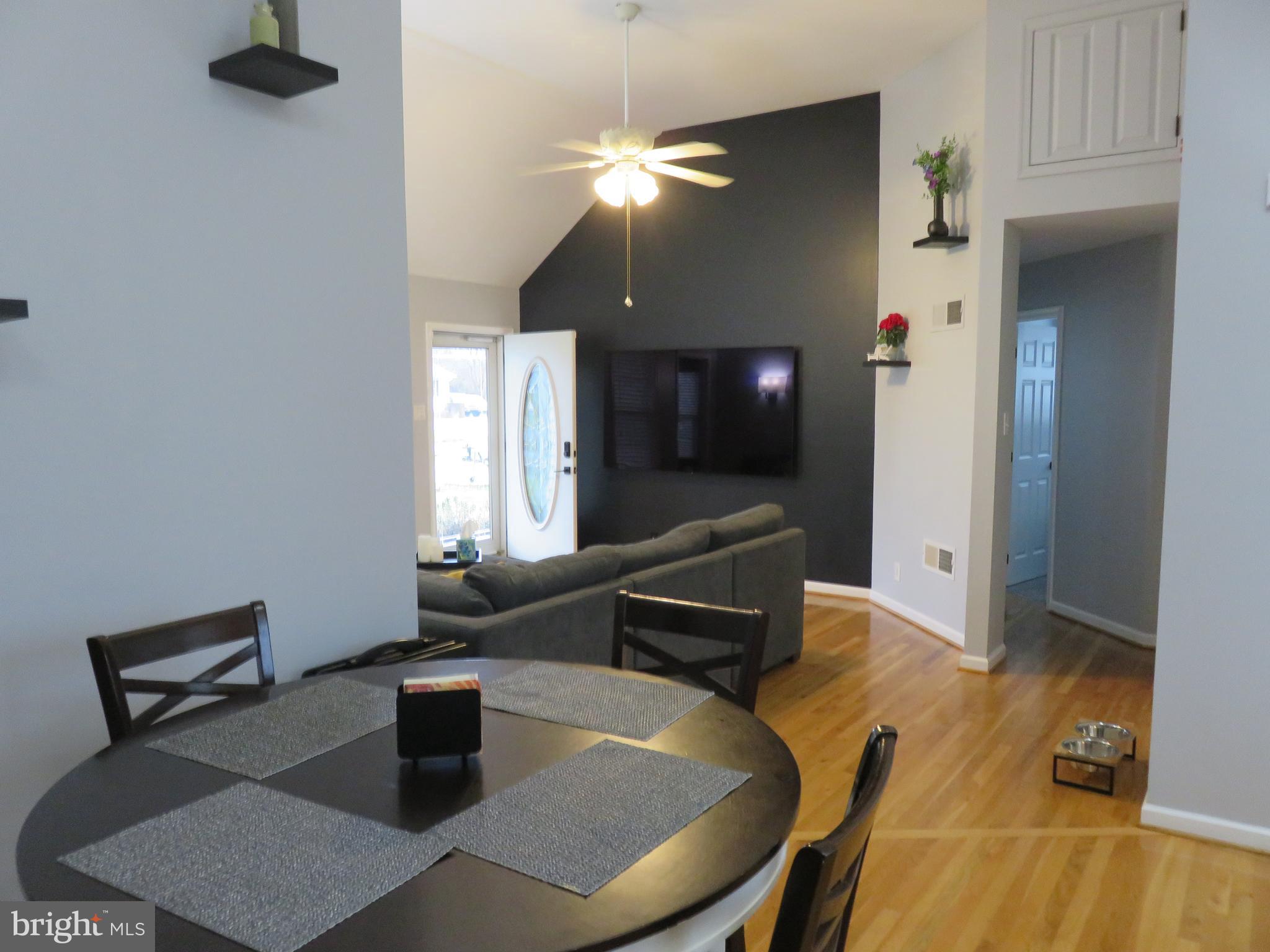 28 Bryan Drive Rehoboth Beach, DE 19971 - Photo 17 of 41 a living room with furniture and a chandelier