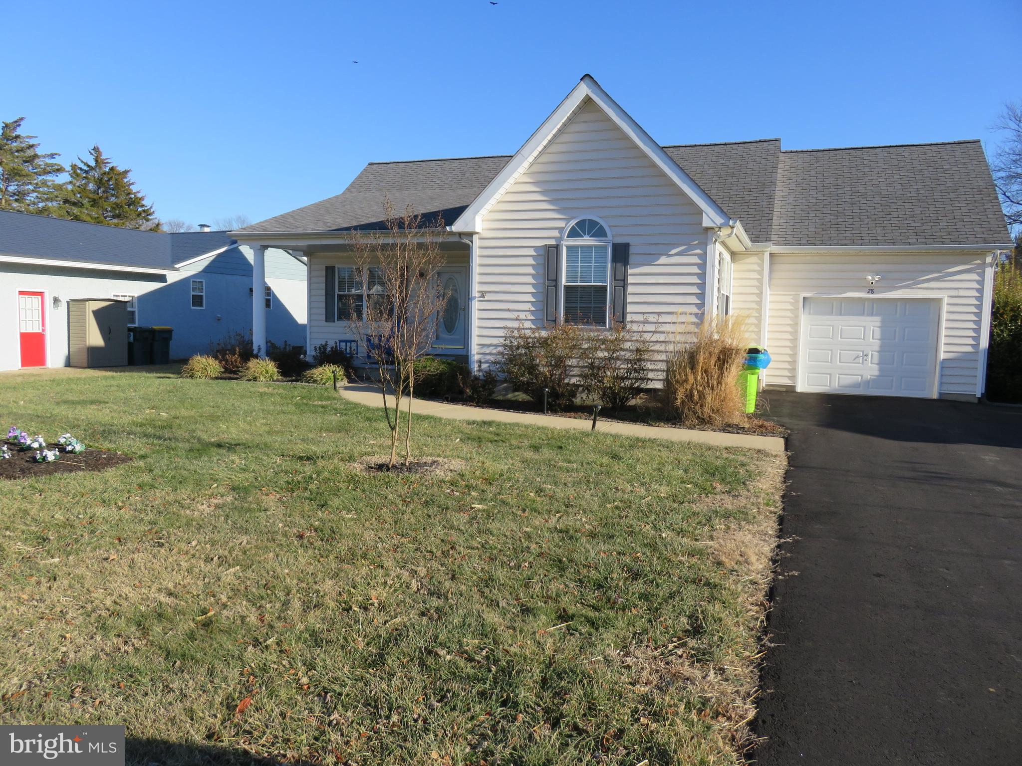 28 Bryan Drive Rehoboth Beach, DE 19971 - Photo 2 of 41 a front view of a house with a yard