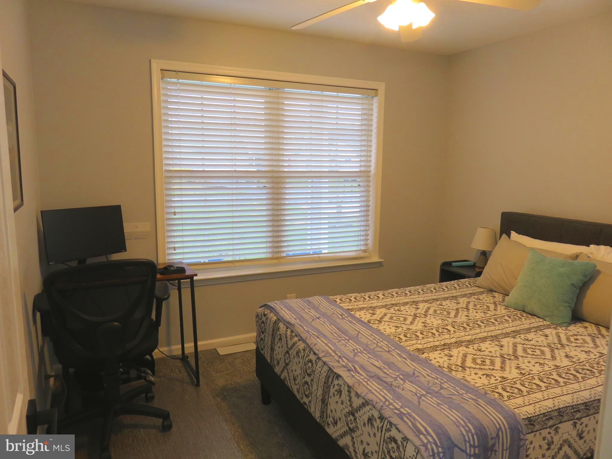 28 Bryan Drive Rehoboth Beach, DE 19971 - Photo 25 of 41 a bedroom with a bed and a window
