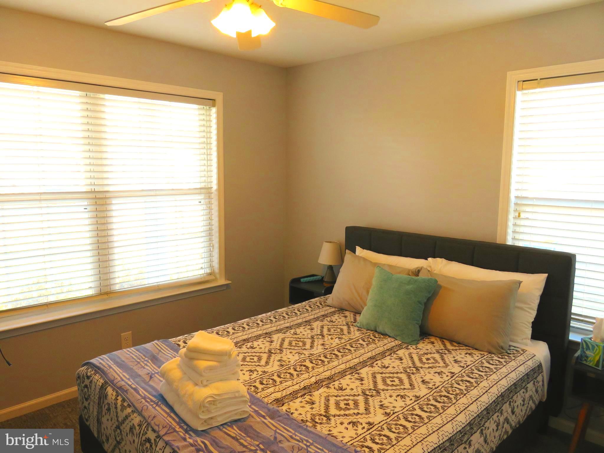 28 Bryan Drive Rehoboth Beach, DE 19971 - Photo 26 of 41 a bedroom with a bed and a window