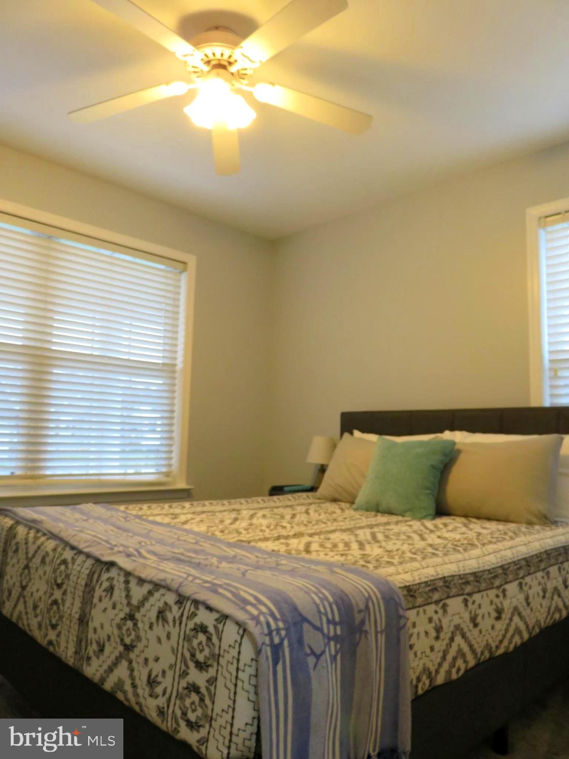 28 Bryan Drive Rehoboth Beach, DE 19971 - Photo 27 of 41 a bedroom with a bed and window
