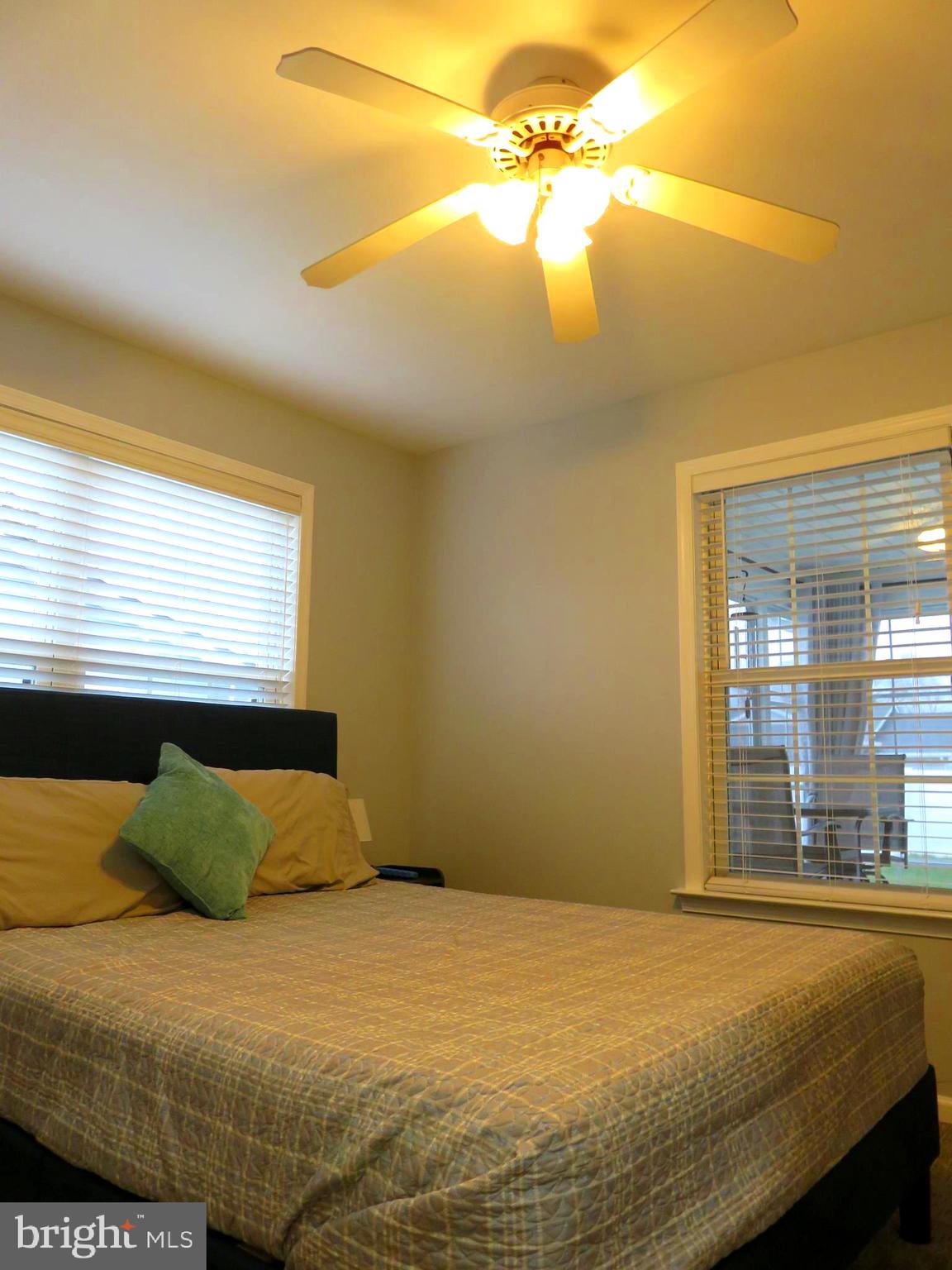 28 Bryan Drive Rehoboth Beach, DE 19971 - Photo 29 of 41 a bedroom with a bed next to a window