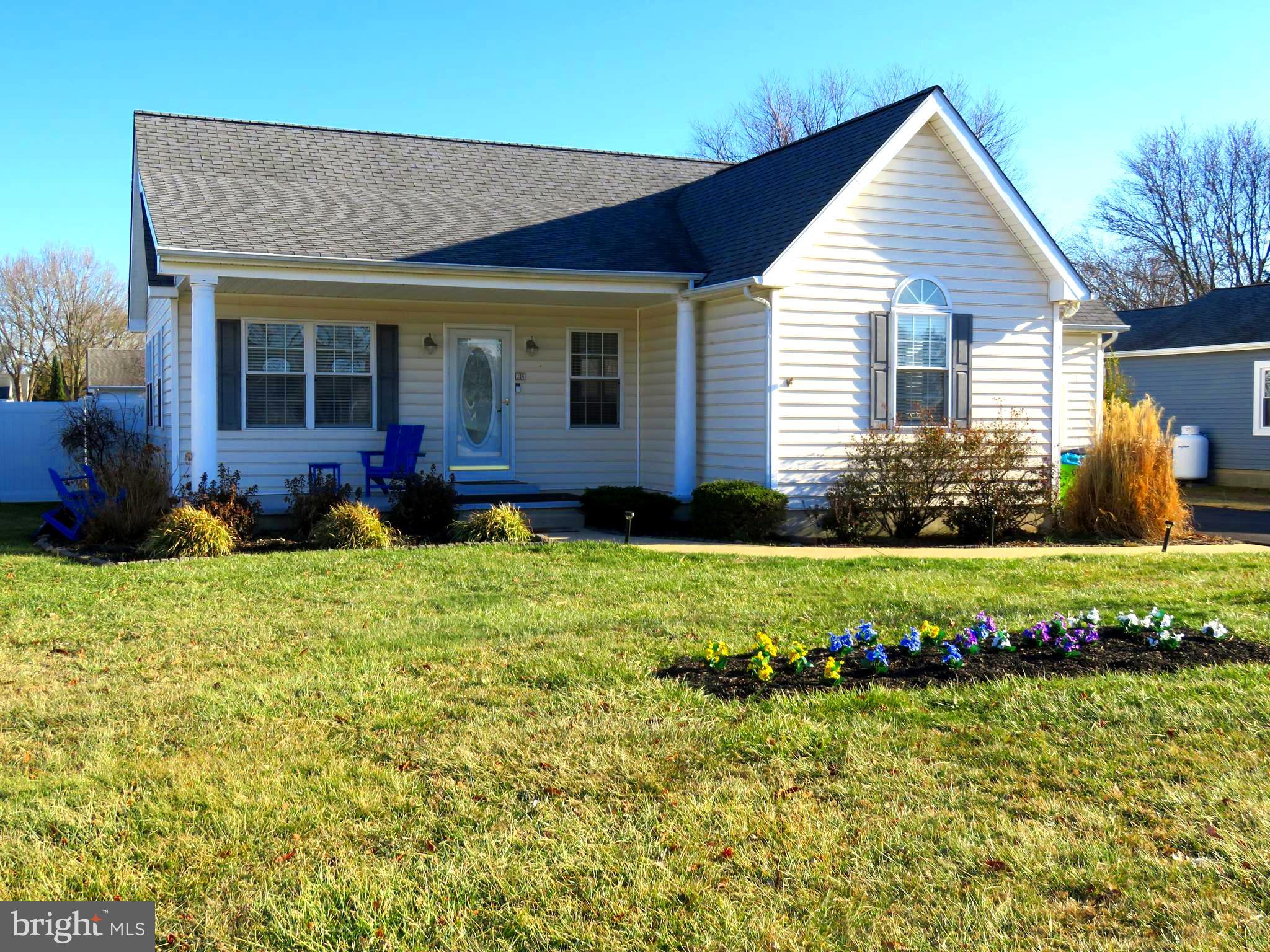 28 Bryan Drive Rehoboth Beach, DE 19971 - Photo 3 of 41 a front view of a house with a yard