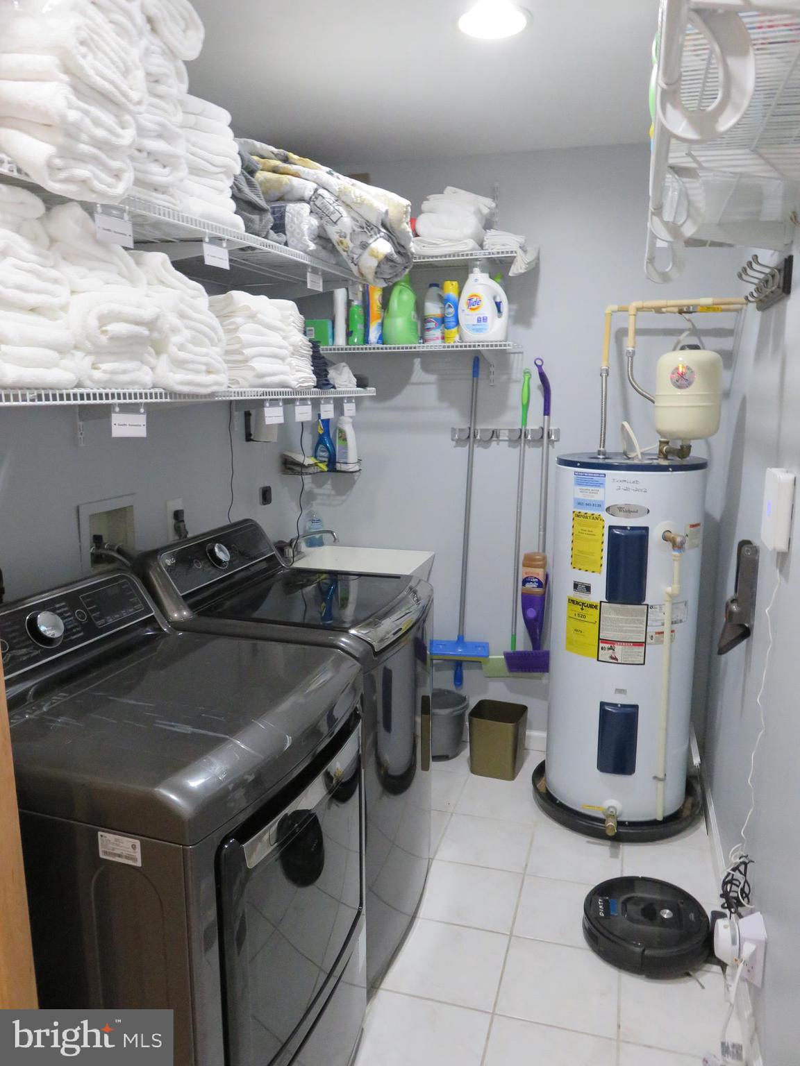 28 Bryan Drive Rehoboth Beach, DE 19971 - Photo 35 of 41 a kitchen with a stove and a wooden floor
