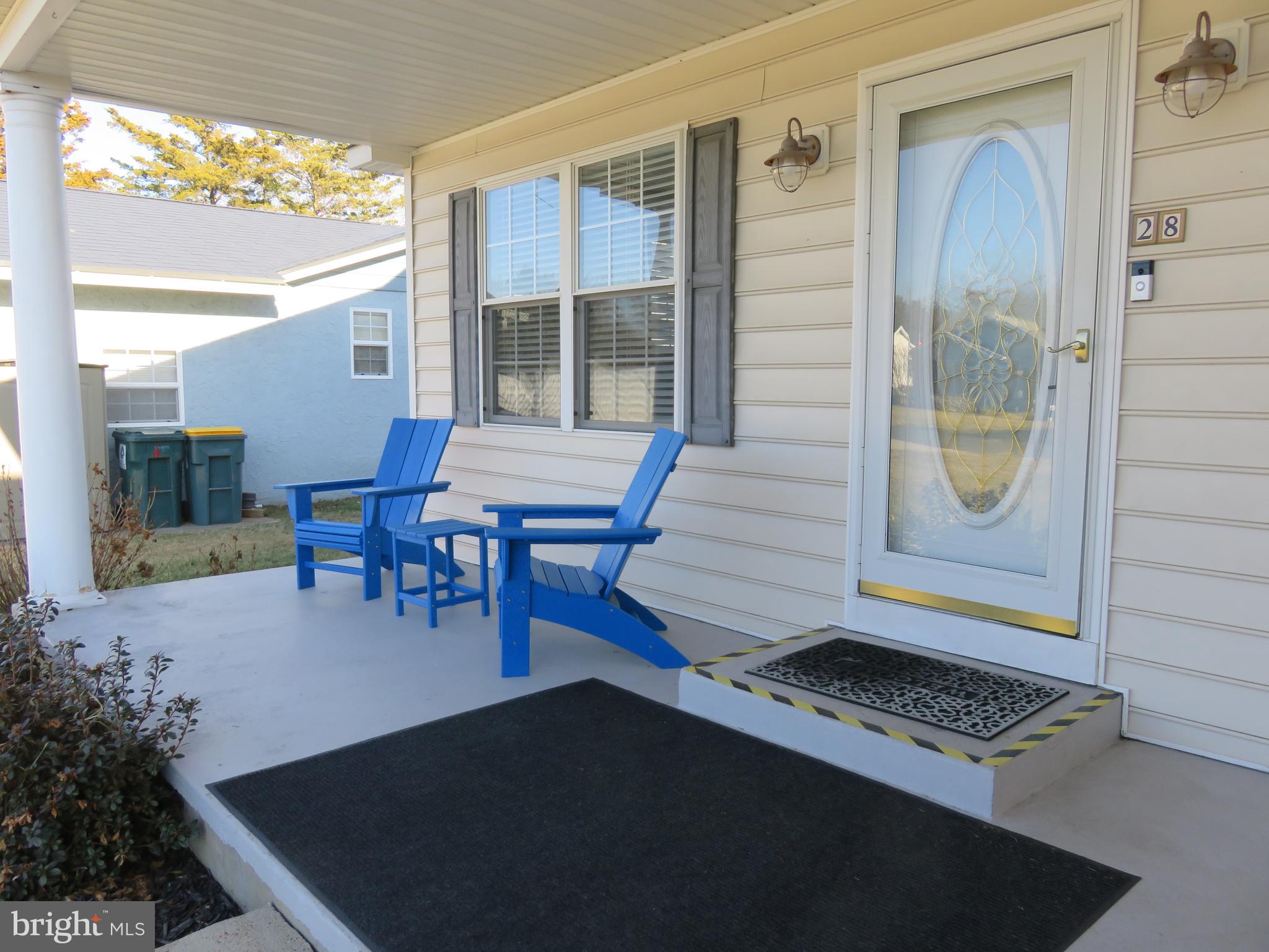 28 Bryan Drive Rehoboth Beach, DE 19971 - Photo 39 of 41 a backyard of a house with barbeque oven table and chairs
