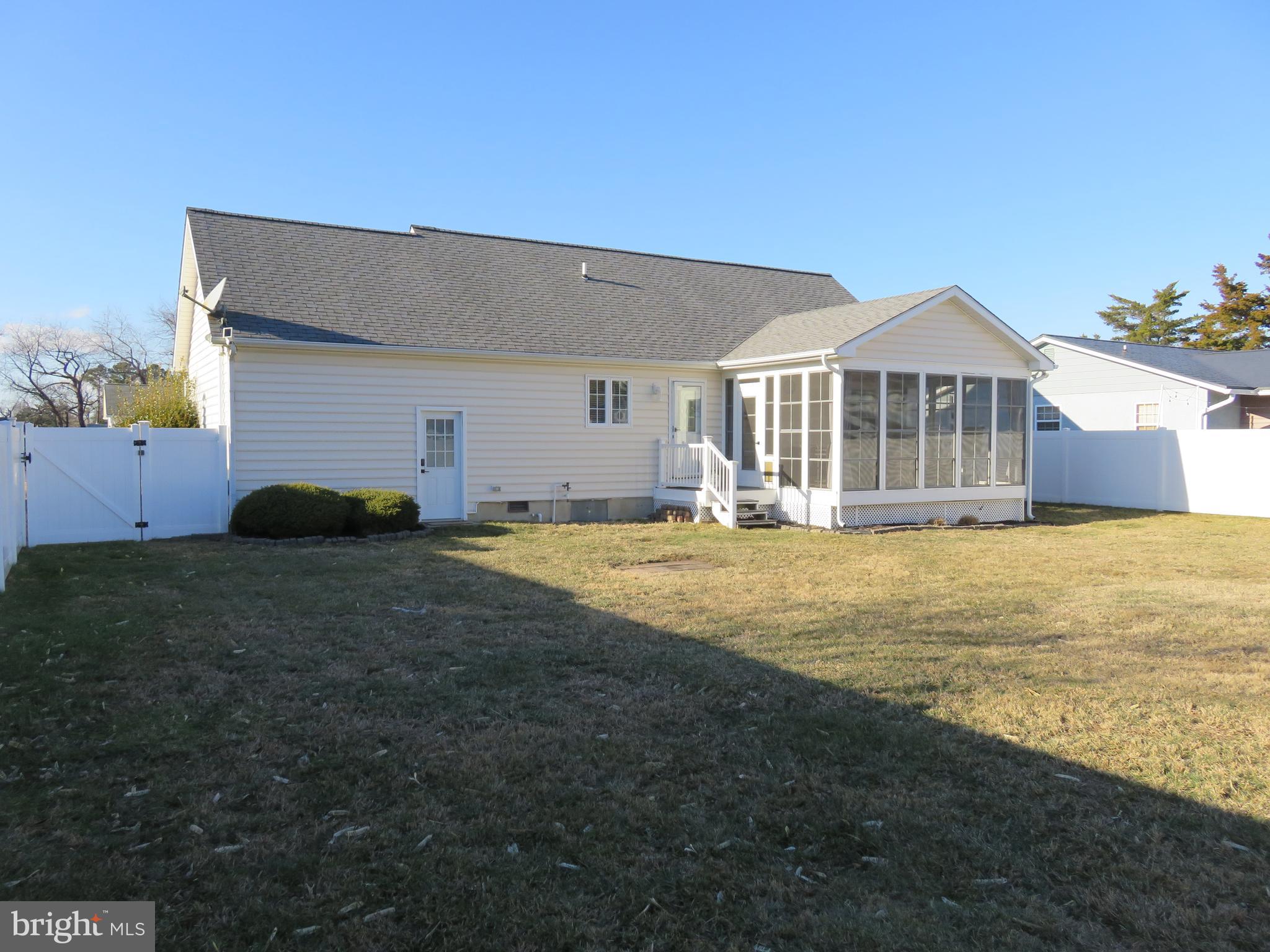 28 Bryan Drive Rehoboth Beach, DE 19971 - Photo 4 of 41 a front view of a house with a yard