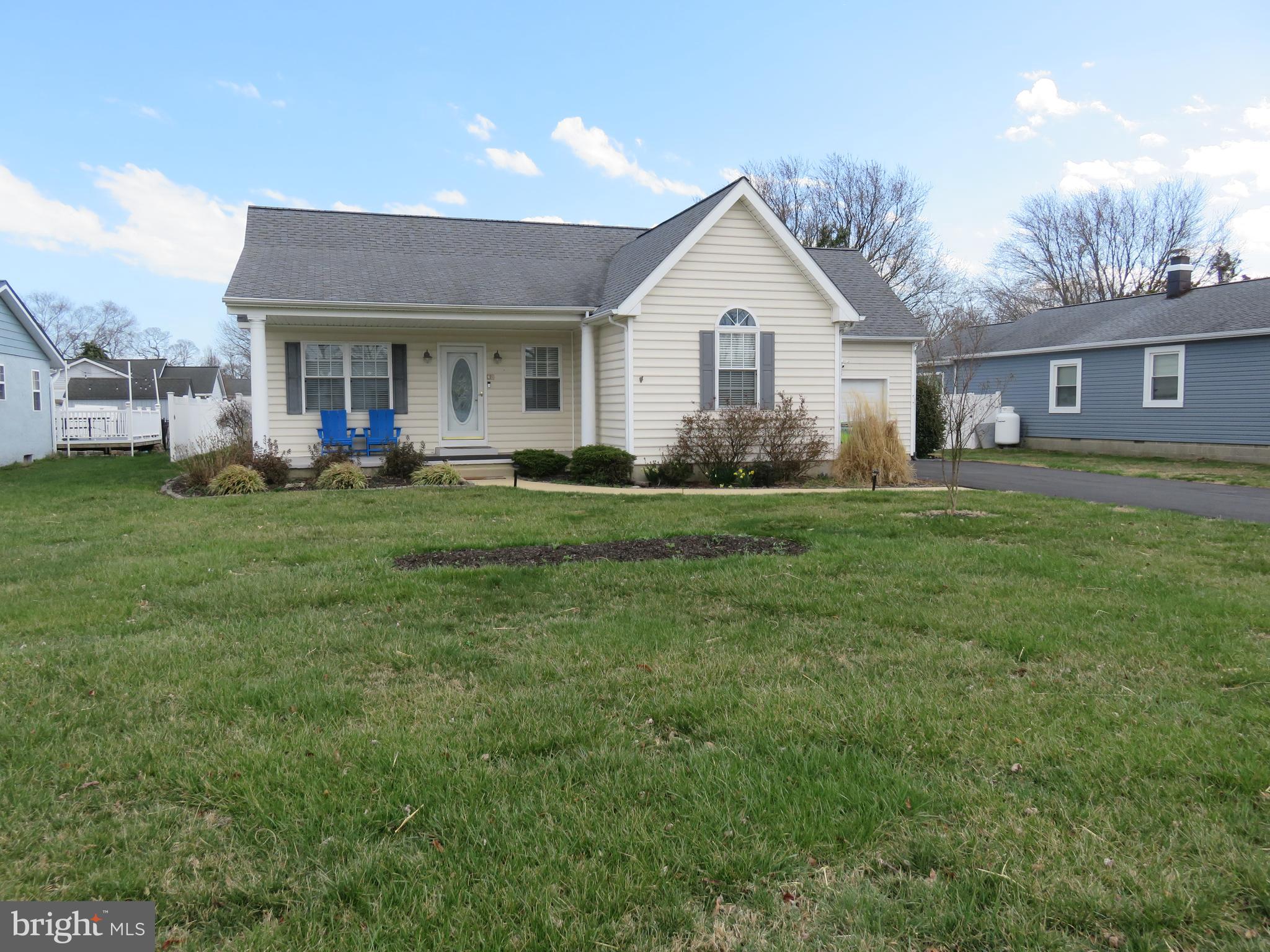28 Bryan Drive Rehoboth Beach, DE 19971 - Photo 41 of 41 a front view of a house with a yard and garage