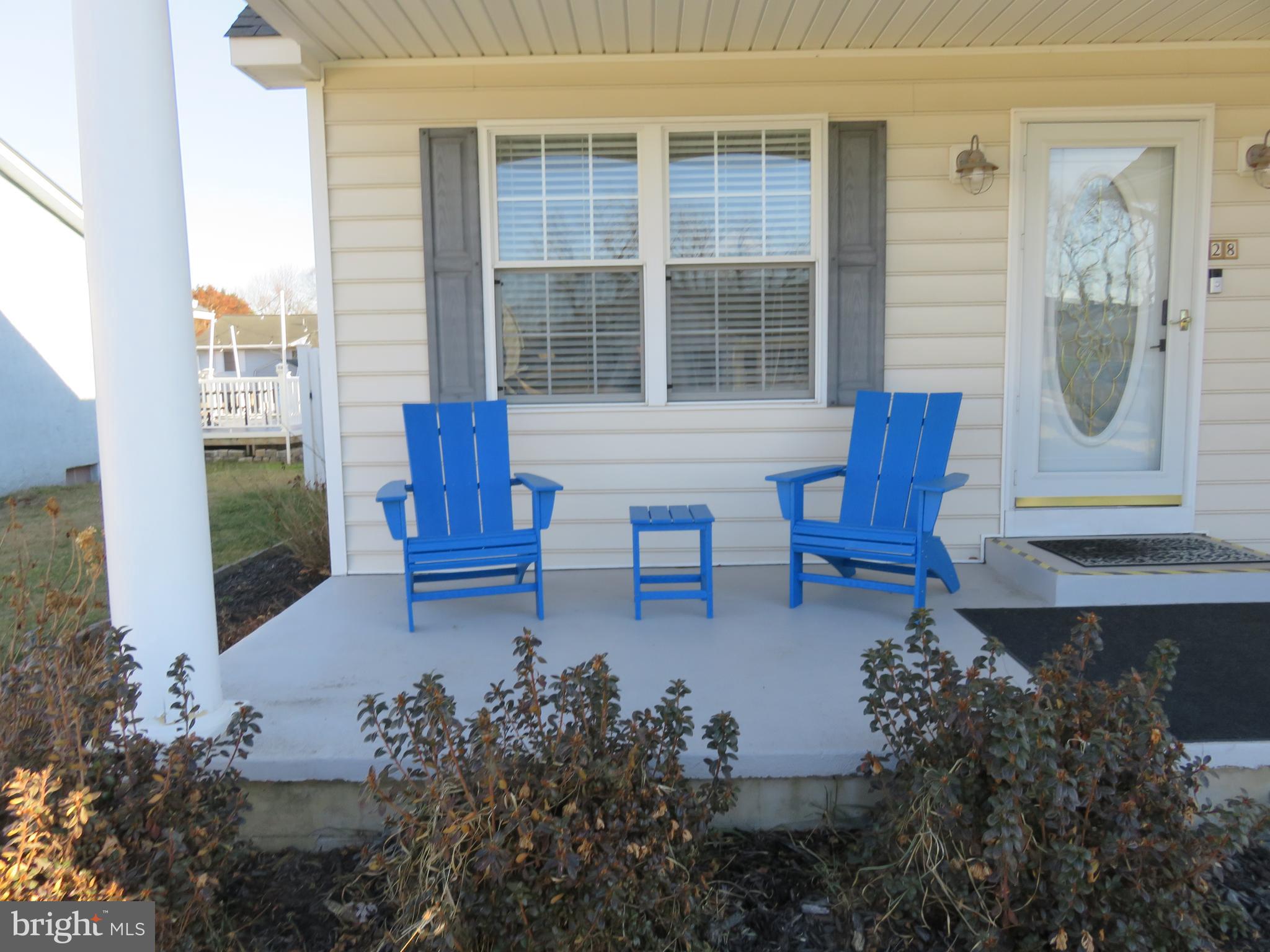 28 Bryan Drive Rehoboth Beach, DE 19971 - Photo 5 of 41 a garden view with a seating space