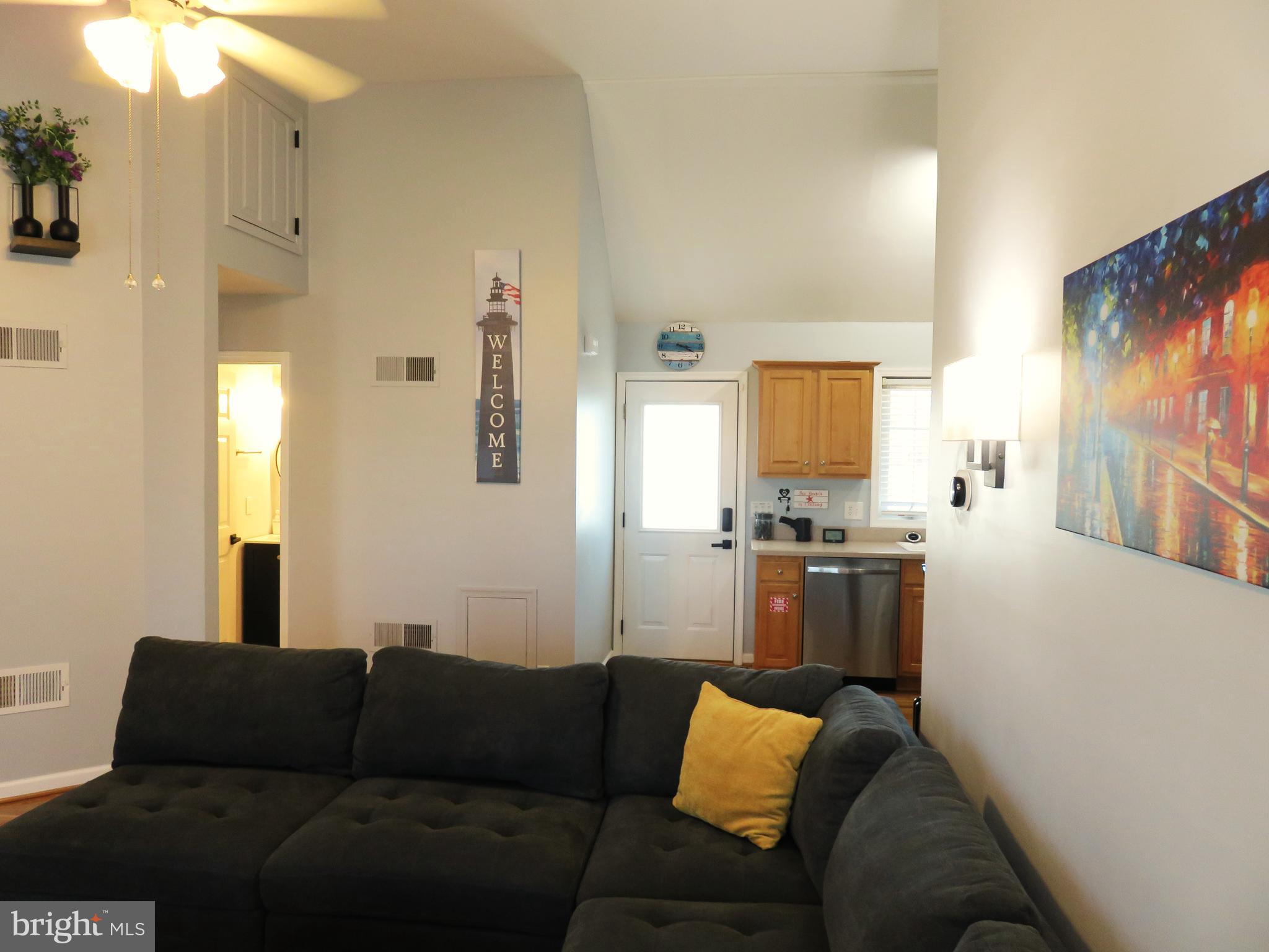 28 Bryan Drive Rehoboth Beach, DE 19971 - Photo 6 of 41 a living room with furniture and a flat screen tv