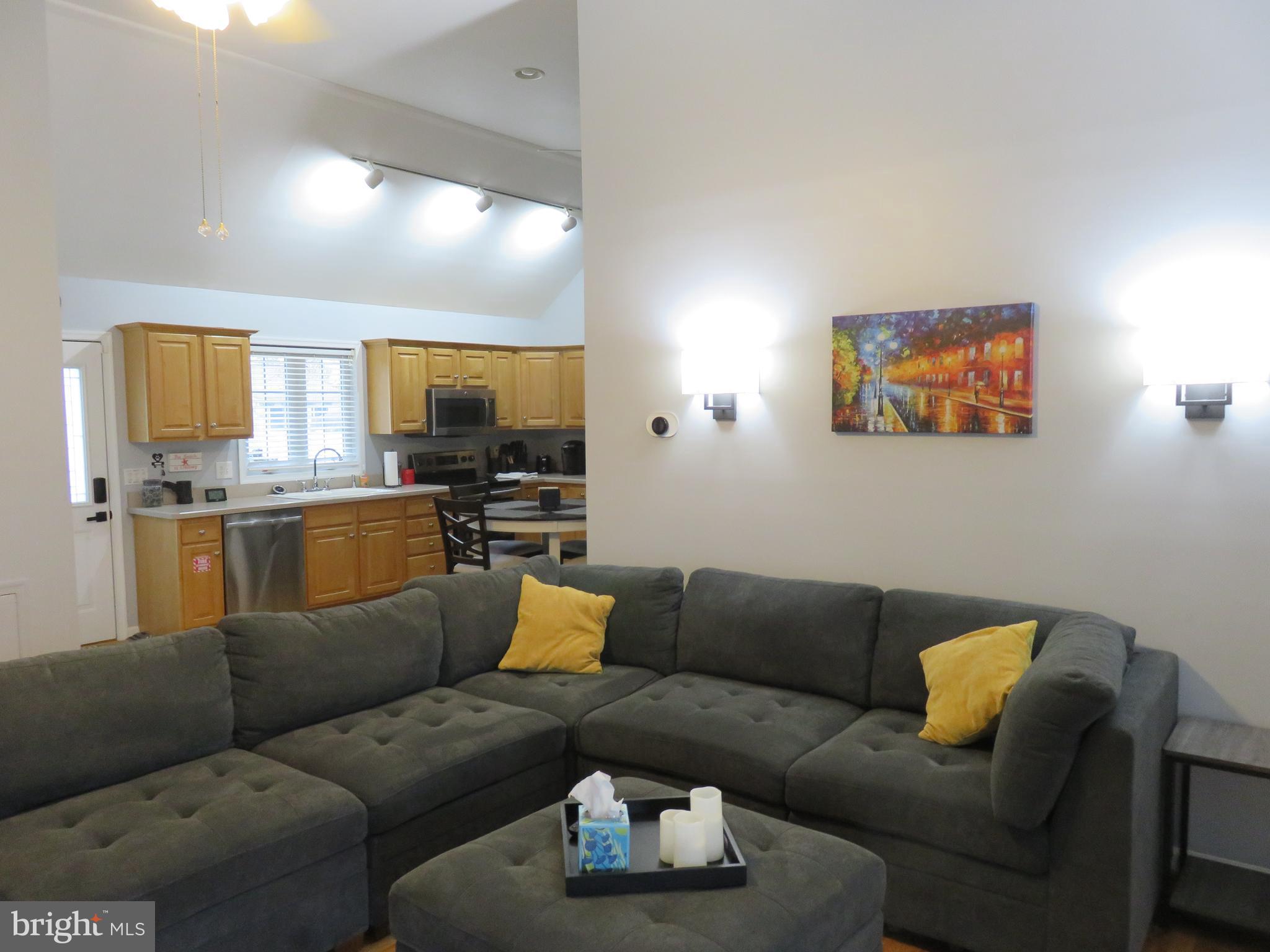 28 Bryan Drive Rehoboth Beach, DE 19971 - Photo 8 of 41 a living room with furniture and kitchen view