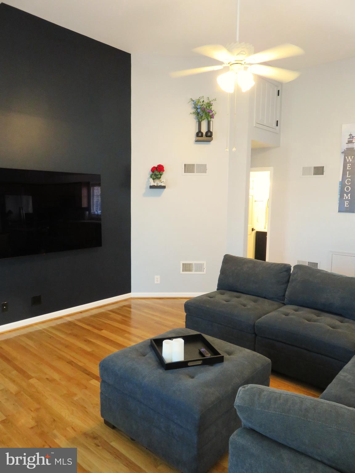 28 Bryan Drive Rehoboth Beach, DE 19971 - Photo 9 of 41 a living room with furniture and a flat screen tv
